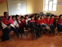 Children listen to a lesson in dental hygiene